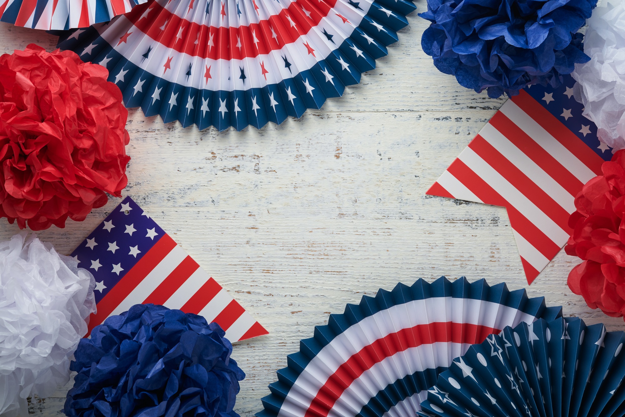 4th of July background. USA paper fans, Red, blue, white stars, balloons, gold confetti on white woo